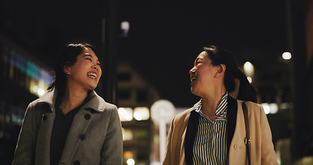 Image showing Night, business people and funny with women, walking and cheerful with peace, humor and laughing. Friends, outdoor or girls with joy, fun or evening with coworkers, Japan and partnership with a break