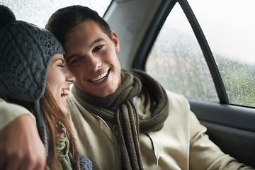 Image showing Love, raining and couple in car for road trip together, laughing on date for travel, vacation or romance. Smile, winter or weather with man and woman in backseat of taxi for holiday trip or journey