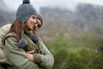 Image showing Couple, hug and smile on hiking vacation in outdoors, love and bonding in relationship for connection. People, embrace and travel for exploring adventure, romance and security in marriage on mountain