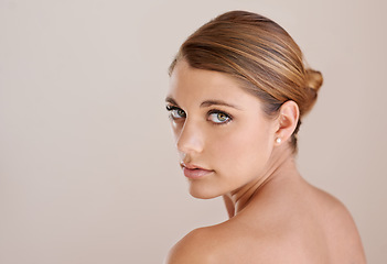 Image showing Portrait, natural beauty and skincare of woman in studio isolated on a brown background mockup space. Face, serious and young model in cosmetics, healthy glow and spa facial treatment dermatology