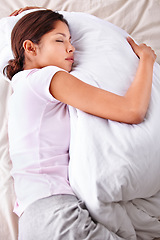 Image showing Sleeping, duvet and woman relax in bedroom for comfort, cozy nap and rest with eyes closed in Puerto Rico home. Top view, fatigue and person sleep on cotton bedsheets with calm, peace and wellness