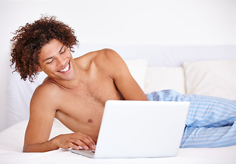 Image showing Laptop, bedroom and relax man laughing at funny communication, social media meme and reading morning news. Comedy joke, network connection and person search internet for meme on home bed