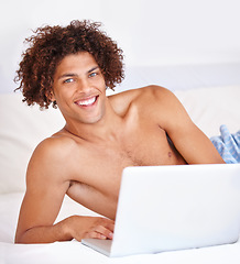 Image showing Laptop, bedroom and portrait of man with smile for work from home blog, social media and morning wellness. Tech, home bed and computer user happy for online report, email or freelance project in USA