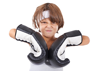 Image showing Boxing, gloves and portrait of child in fight with anger and learning martial arts in white background. Challenge, boxer or kid with training in self defense, exercise or practice with gear in studio