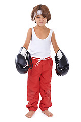 Image showing Boxing, child and angry portrait for fight with courage for martial arts in white background. Challenge, boxer or kid with mma training in self defense, exercise or practice with gear in studio