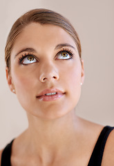 Image showing Face, beauty and skincare of woman in makeup for spa facial treatment for aesthetic. Thinking, model in cosmetics and glow for wellness, health and dermatology isolated on a brown studio background