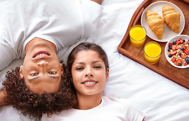 Image showing Couple, portrait and breakfast in bed for bonding, healthy meal and celebrating anniversary at home. People, marriage milestone and love or loyalty in relationship, romance and food for nutrition