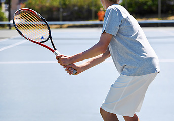 Image showing Back, tennis and person with racket, court and fitness with energy and training with competition. Player, sunshine and player with equipment and workout with teenager, sports and exercise with game
