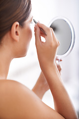 Image showing Hair removal, mirror and woman with tweezers for eyebrow, beauty care or cosmetic treatment. Home bathroom, cosmetology and person microblading, anti aging and plucking for face grooming