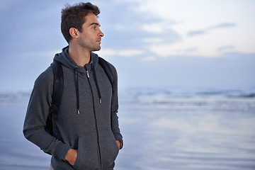 Image showing Thinking, beach and man with holiday, travel and backpack with vacation, summer break or getaway trip. Person, seaside or traveller with nature or wellness with water, explore or adventure or journey