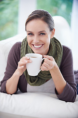 Image showing Coffee, happy and portrait of woman in home with calm, wellness and peace on sofa in living room. Morning, breakfast and person with mug relax and drinking tea, caffeine and hot beverage in house