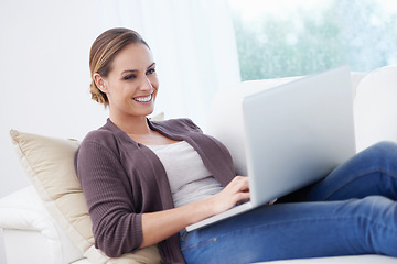 Image showing Woman, remote work and laptop to relax on sofa for blog post, social media or reading digital research. Happy freelancer, computer or download movie subscription, online shopping or elearning at home