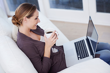 Image showing Relax, laptop and happy woman on a sofa with coffee while streaming movie, film or video at home. Pc, internet or female person in a living room with tea, break or social media, subscription or show