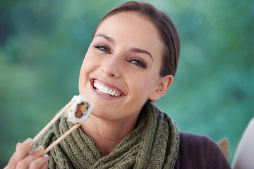 Image showing Woman, sushi and food in portrait, eating lunch or dinner, Japanese cuisine and seafood with chopsticks. Catering, healthy and diet, relax with meal at home and happy with dish for nutrition