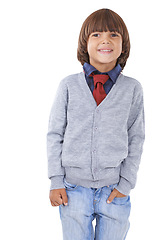 Image showing Fashion, happy and child on a white background with trendy clothes, cute style and casual outfit. Childhood, facial expression and isolated young kid with smile, happiness and confidence in studio