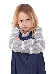 Image showing Girl, child and angry in portrait with arms crossed, frustrated and stress, emotion and frown on white background. Youth, upset or disappointed with tantrum, bad attitude with problem in studio