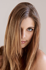 Image showing Portrait, straight hair and beauty of woman in salon treatment for keratin care. Serious face, hairstyle shine and young model in makeup cosmetics at hairdresser isolated on a gray studio background