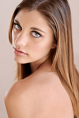 Image showing Confident, cosmetics and portrait of young woman with natural, glow and glamour facial routine. Makeup, beauty and serious attractive female person with self care, dermatology and face treatment.