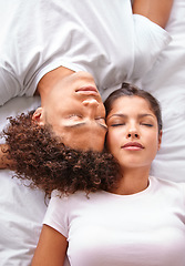 Image showing Sleeping, duvet and face of couple in bedroom for comfort, cozy nap and rest with eyes closed in Puerto Rico home. Bed, fatigue and top view of man, woman or people sleep with calm, peace or wellness