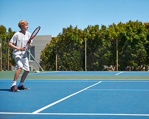 Image showing Tennis, sports and teenager with energy, training and performance with competition or workout. Person, player or athlete with racket or court with wellness, activity or game with sunshine or hobby