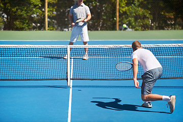 Image showing Tennis, game and men with fitness, back and competition with training and challenge with a match. Players, friends and guys with rackets and court with workout and sunshine with sports and ball