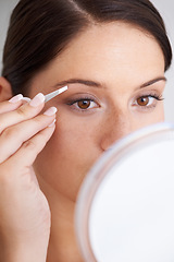 Image showing Plucking, eyebrow and woman with tweezers for beauty, self care and mirror in bathroom. Makeup, routine and girl with hair removal, tools and facial grooming or cleaning for skincare and cosmetics