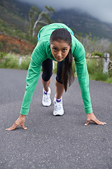 Image showing Woman, on her mark and start run for fitness, race or marathon with athlete training outdoor. Runner is ready, portrait and exercise, cardio and speed with challenge, sports for health and wellness