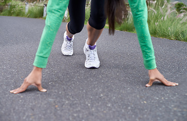 Image showing Woman, hands and feet, start running for fitness with race or marathon, athlete preparing and training outdoor. Runner is ready, exercise for cardio and speed with challenge, sports and health