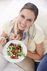 Image showing Top view of woman, eating salad and food for nutrition, vegetables and lunch with happiness in portrait. Diet, wellness and healthy vegan meal for cholesterol, detox and snack for dinner at home