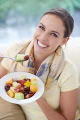 Image showing Healthy food, happy woman in portrait and fruit in salad for diet, organic meal and relax on sofa with smile for weight loss. Vegan, gut health and wellness, eating for nutrition with vitamins