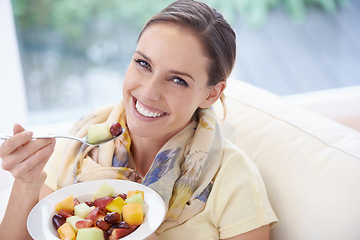 Image showing Food, happy woman in portrait and fruit in salad for diet, organic meal and relax on sofa with smile for weight loss. Vegan, gut health and wellness, healthy eating for nutrition with vitamins