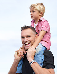 Image showing Love, portrait and piggyback by father and son outdoor for fun, bonding or travel adventure. Happy family, support or parent with boy kid outside for shoulder ride, games or care, security or journey