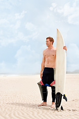 Image showing Thinking, smile and shirtless man with surfboard on beach in wetsuit for sports, travel or fitness. Nature, vision and body of young surfer on sand by ocean or sea for exercise, training and workout