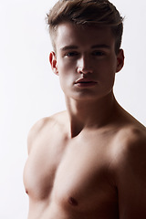 Image showing Portrait, natural and masculine with body of man in studio on white background for health or wellness. Face, skin or bare chest and young shirtless model for aesthetic, hygiene and satisfaction