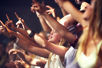 Image showing Night, concert and fans dance to music, performance and audience with energy at festival. Crowd, support and people stretching hands in celebration or praise of rock, culture or excited at event