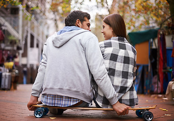 Image showing Couple, travel on skateboard and outdoor in city, happy and conversation with partner, learn together and relationship. Cape town, fun and hobby with boyfriend and girlfriend in street, love or date