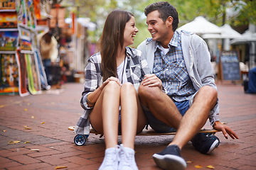 Image showing Couple, travel on skateboard and happy in city, outdoor and conversation with partner, learn together and relationship. Cape town, fun and hobby with boyfriend and girlfriend in street, love or date