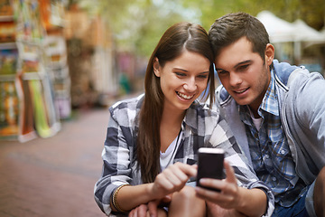 Image showing City, smile and couple with a cellphone, internet and social media with texting, digital app or meme. New York, man or woman with a smartphone, mobile user or connection with network, joy or marriage