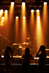 Image showing Silhouette, band and playing at stage for concert, spotlight and instruments for music festival. Musician, singing and sound entertainment by event equipment by technology and audio performance