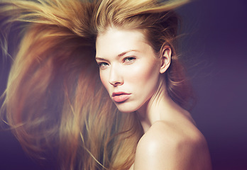 Image showing Hair, wind and portrait, woman and beauty with makeup, cosmetic care and glamour on black background. Skin, glow and model with salon hairstyle, keratin treatment and wellness in studio for grooming