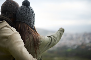 Image showing Back, hiking and pointing with couple in nature together for love, dating or sightseeing. Travel, environment or view with man and woman on mountain peak for bonding on adventure, holiday or vacation