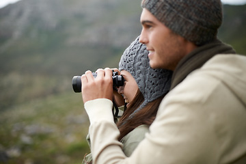 Image showing Binoculars, nature and couple on mountains for journey, adventure and hiking or explore on carbon footprint travel. Love with man and woman in outdoor gear for birdwatching, winter tourism and search