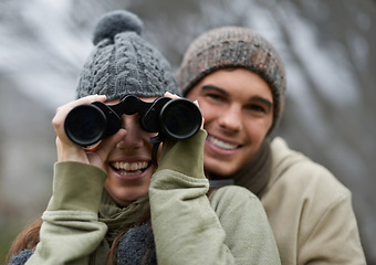 Image showing Binoculars, nature and happy couple in portrait for journey, adventure in hiking or carbon footprint travel. Face of young man and woman with outdoor gear for birdwatching in winter, nature or woods