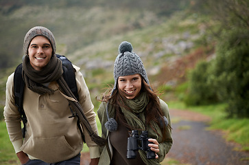 Image showing Couple, portrait and hiking on mountain or happy for travel, adventure or holiday for experience or fitness. Man, woman and trekking outdoor nn trail for cardio, exercise or workout with binocular