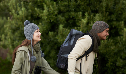 Image showing Couple, happy and hiking in forest or outdoor with travel, adventure or holiday for experience or fitness. Man, woman and trekking in woods or nature for cardio, exercise or workout with backpack