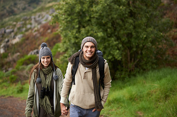 Image showing Couple, portrait and hiking on mountain or holding hands with travel, adventure or holiday for experience or fitness. Man, woman or trekking outdoor on trail for cardio, exercise or workout with love