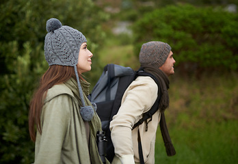 Image showing Couple, happy and hiking in forest or nature with travel, adventure or holiday for experience or fitness. Man, woman or trekking outdoor in woods for cardio, exercise or workout with view or backpack