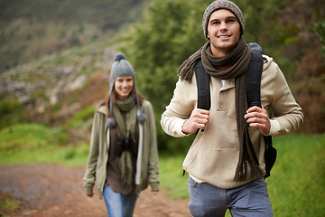 Image showing Couple, smile and hiking in forest or nature with travel, adventure or holiday for experience or fitness. Man, woman or trekking outdoor in woods for cardio, exercise or workout with care or backpack