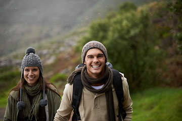 Image showing Portrait, hiking and happy with couple, tourist and walking with backpack, mountain and bonding together. Outdoor journey, adventure and trekking in path, field and exercise for fitness and travel