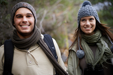 Image showing Couple, happy and hiking in forest or nature for travel, adventure or holiday for experience or fitness. Man, woman and trekking outdoor in woods for cardio, exercise or workout with care or backpack